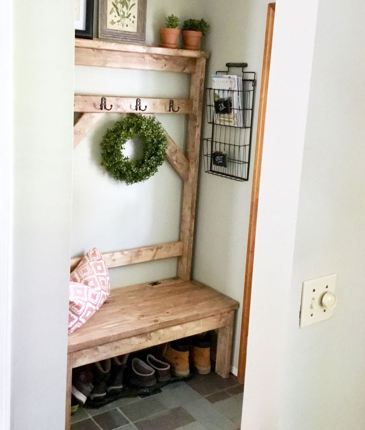 a wooden bench sitting next to a doorway