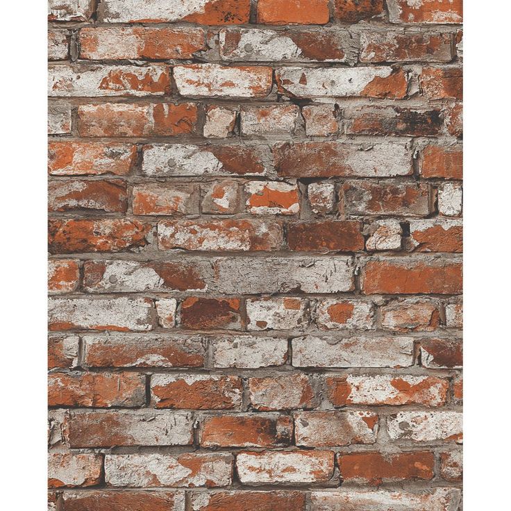 an old brick wall with white and red paint