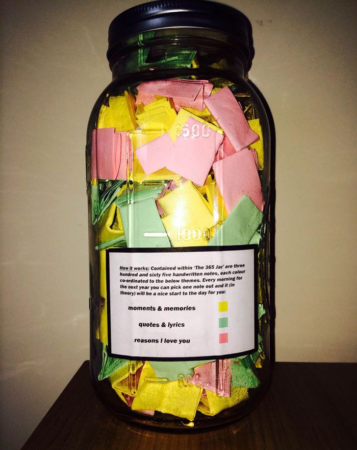 a jar filled with candy sitting on top of a table