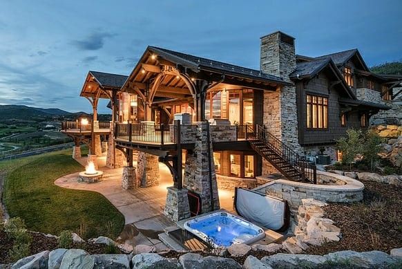 a large house with a hot tub in front of it