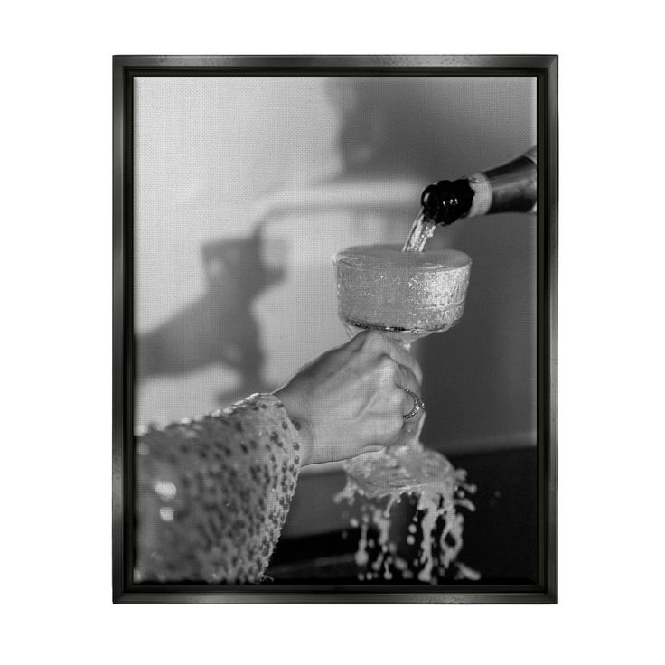 a black and white photo of someone pouring water