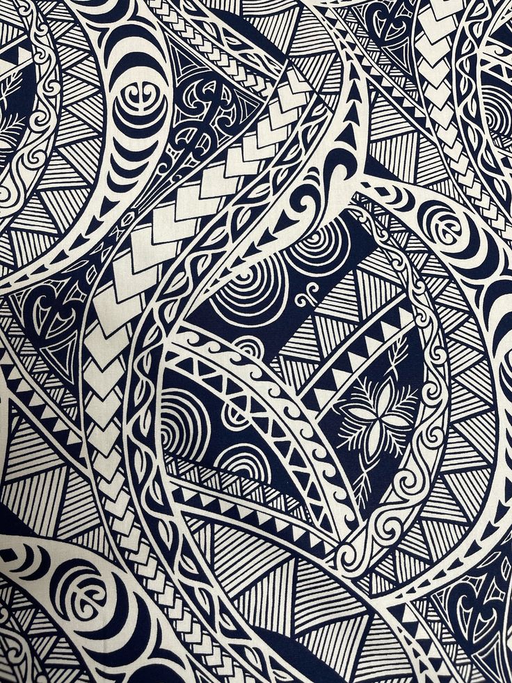 an intricate blue and white design on a piece of paper with some black lines in the middle