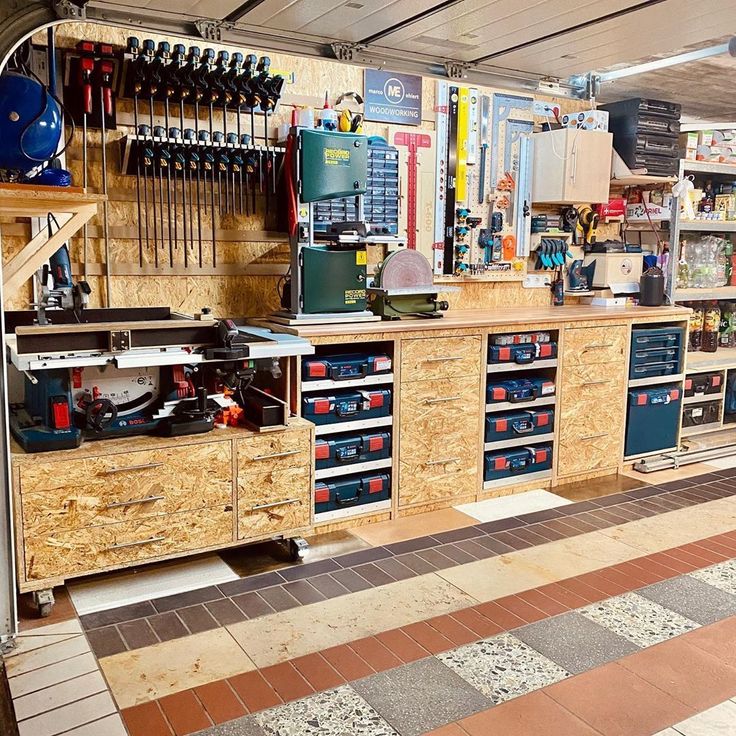 a workbench with lots of tools on it in a garage or workshop area