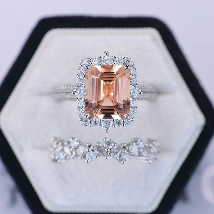 an engagement ring and wedding band set with a fancy peach morganite surrounded by diamonds