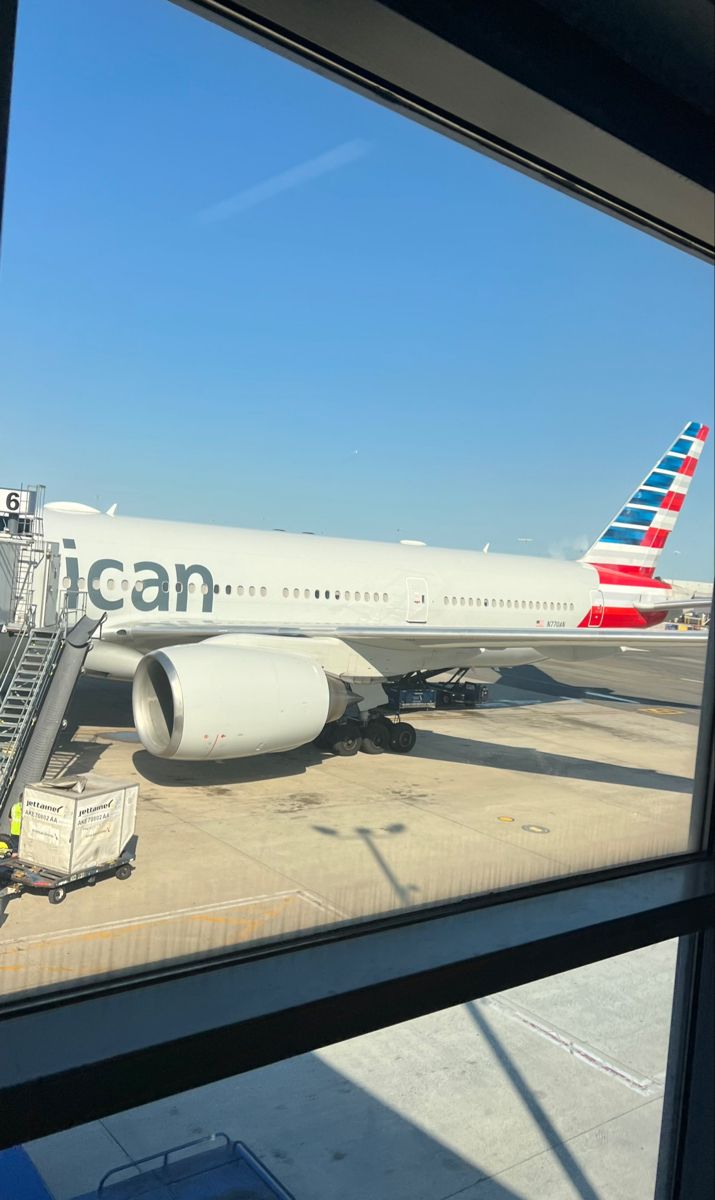 an american airlines plane is parked at the airport