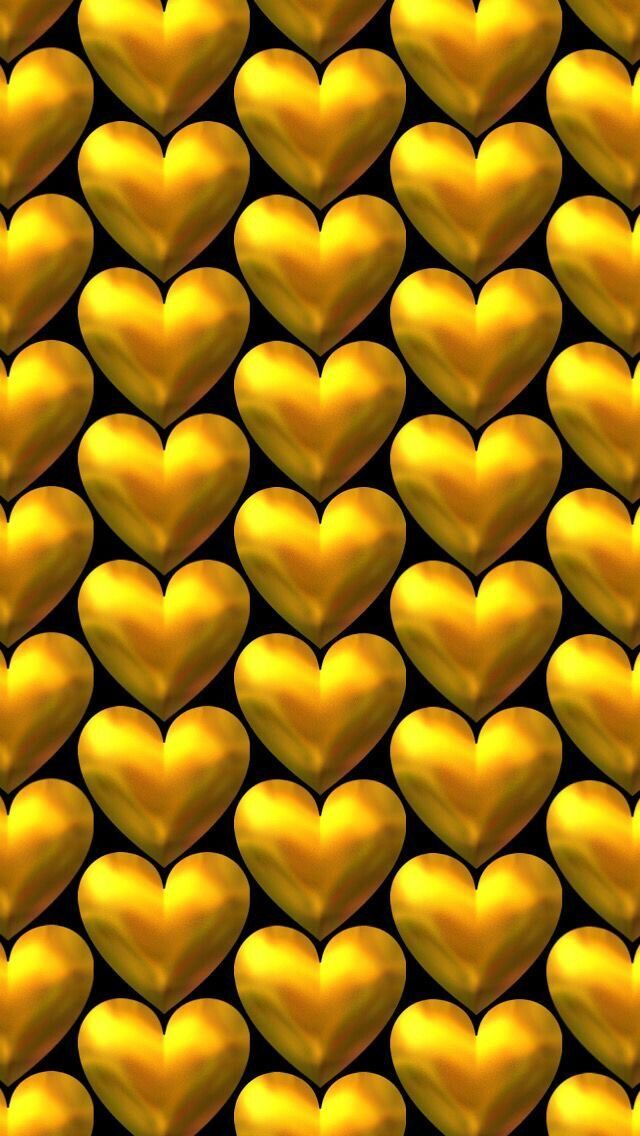 many gold hearts are arranged in the shape of a heart