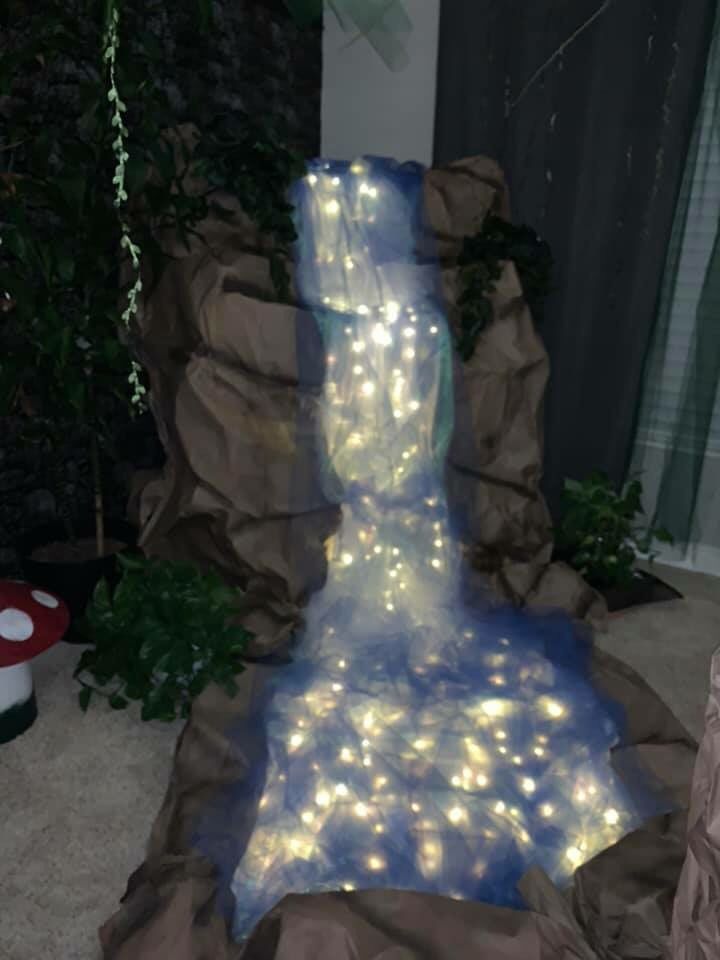 there is a fake waterfall with lights on it