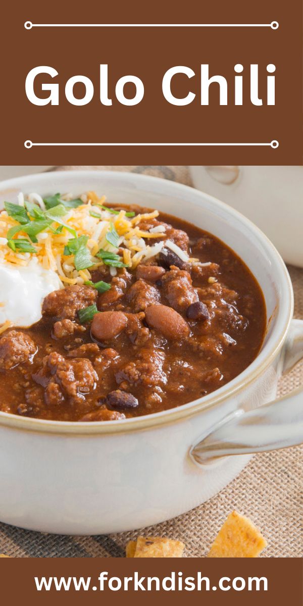 a white bowl filled with chili, beans and sour cream on top of a table