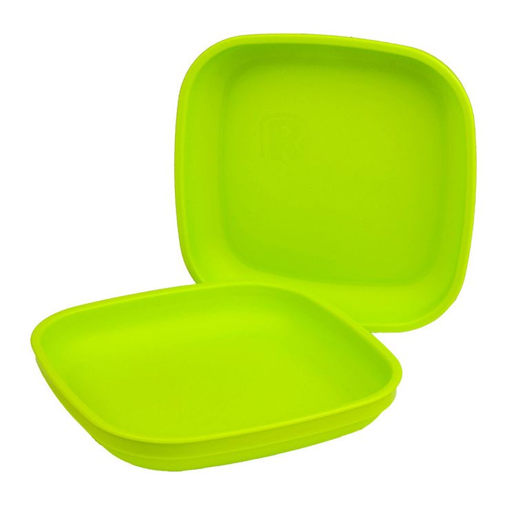 two lime green plastic plates on a white background