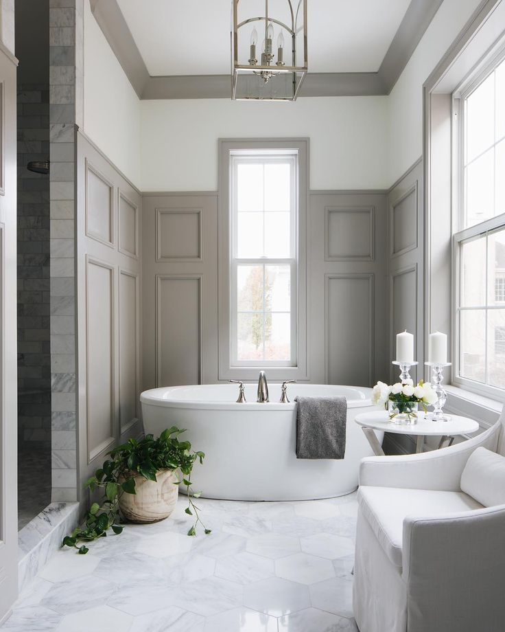 the instagram page shows an image of a bathroom with white fixtures and gray walls