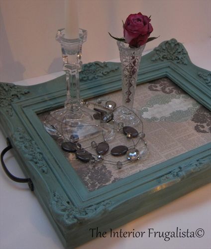 there is a glass tray that has a rose in it