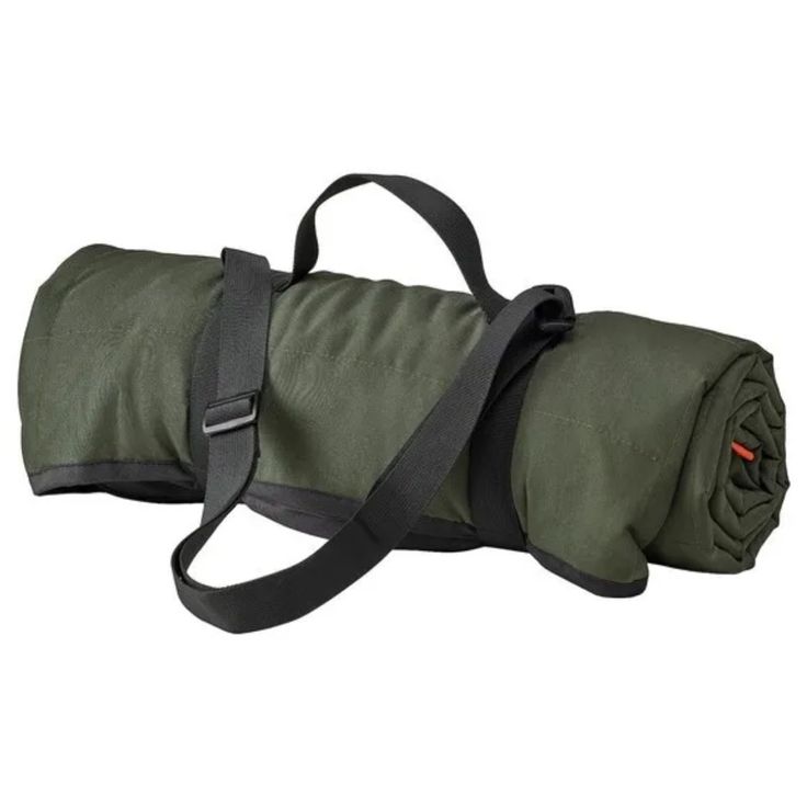 a green sleeping bag with straps on it