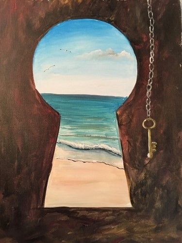 an open door to the ocean with a key hanging from it