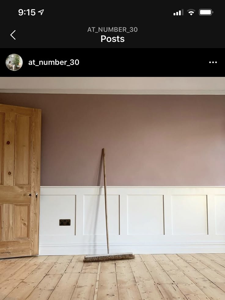 an empty room with a mop on the floor