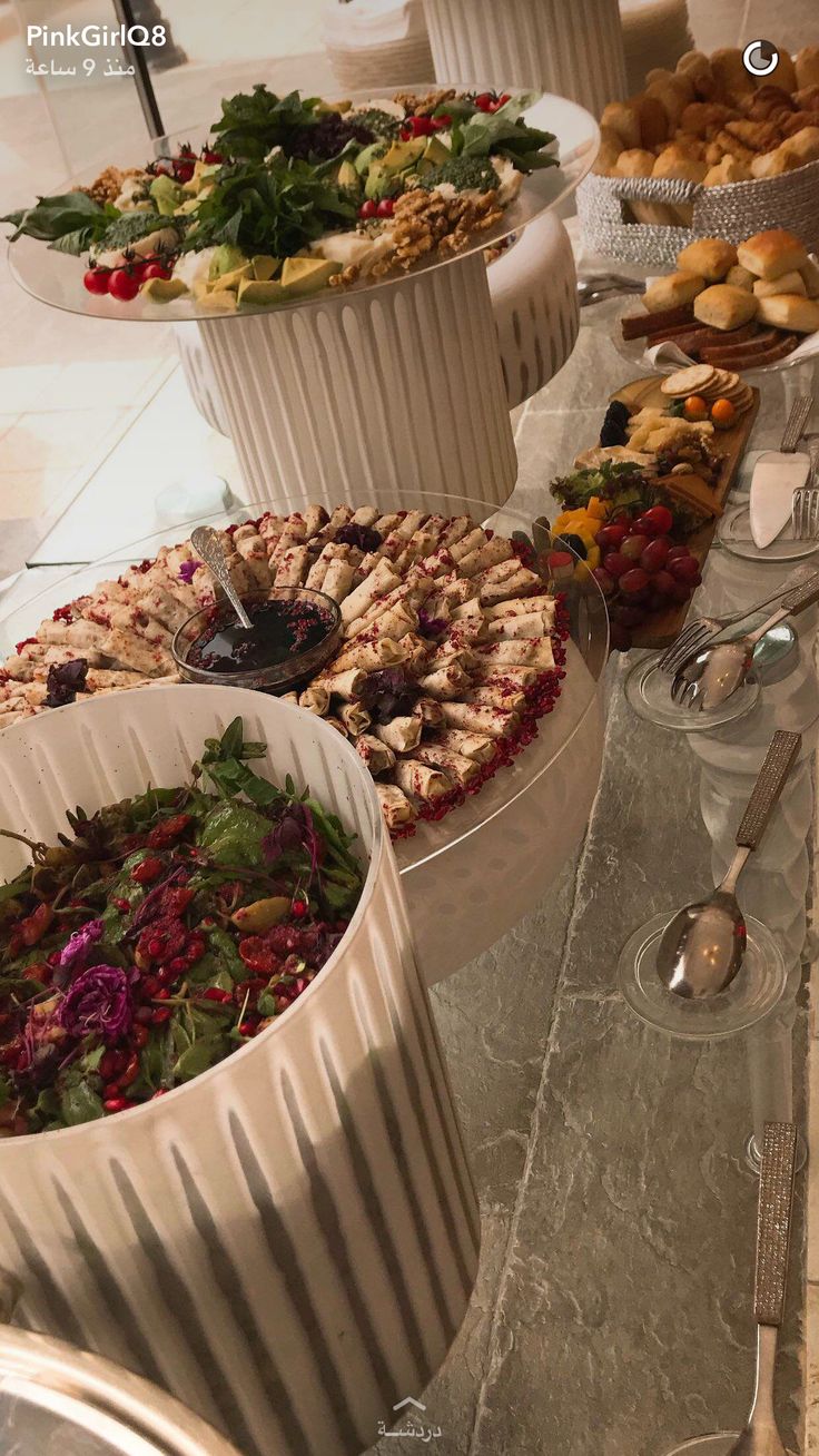 an assortment of desserts and pastries on a buffet table