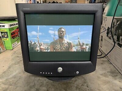 an old television sitting on top of a table in a room with other items around it