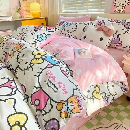 a bedroom with hello kitty bedding and pink walls