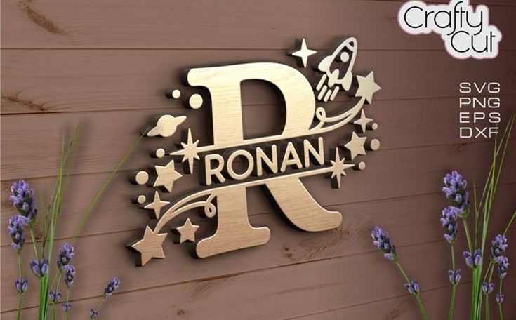 a wooden sign with the letter r on it next to lavenders and flowers in front of a wood wall