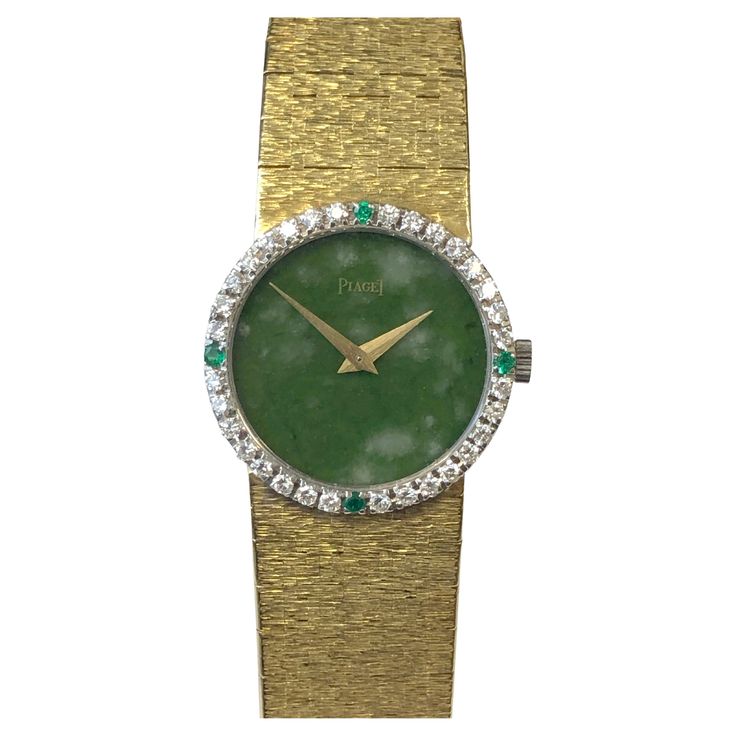 Circa 1970s Ladies Piaget Wrist Watch, 24 M.M. 18K Yellow Gold 2 piece case, Diamond and Emerald set Bezel, 17 jewel mechanical, manual wind movement. Jadite stone dial. 5/8 inch wide soft flexible textured bracelet, watch length 6 1/2 inches. Recently serviced and comes with a one year warranty. Piaget Ring, Emerald Set, Textured Bracelet, Wind Movement, Girls Best Friend, Gold Watch, Time Piece, 2 Piece, Gold Diamond