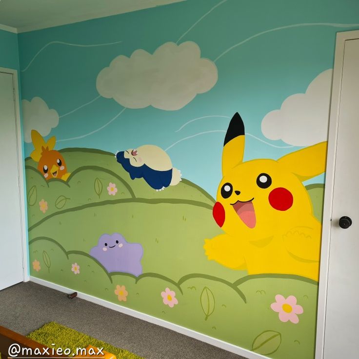 a room with a wall mural depicting pikachu and other pokemon characters