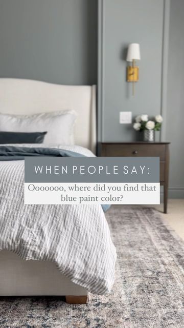 a bed sitting on top of a rug in a bedroom