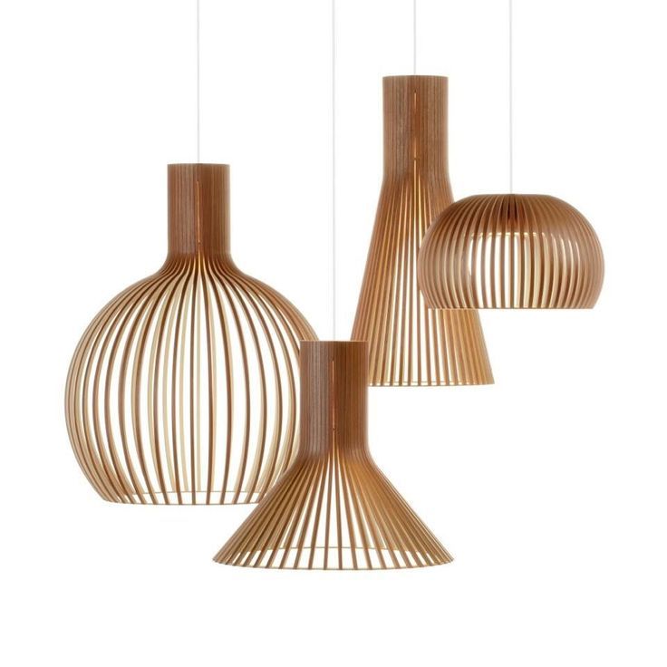 three wooden lamps hanging from the ceiling