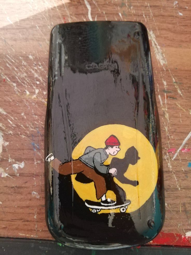 a skateboarder is depicted on the side of a glass bottle that has been painted