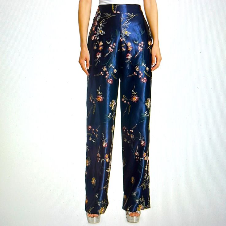 Floral Garden Embroidered Satin Pants Banded Waist Front Elasticized Waist Back Pull On Style Side Seam Pockets Silk Floral Print Straight Pants, Silk Floral Print Long Bottoms, Silk Floral Print Long Pants, Silk Floral Straight Pants, Silk Long Pants With Floral Print, Silk Straight Pants With Floral Print, Elegant Fitted Bottoms With Floral Embroidery, Festive Silk Straight Pants, Embroidered Silk Pants