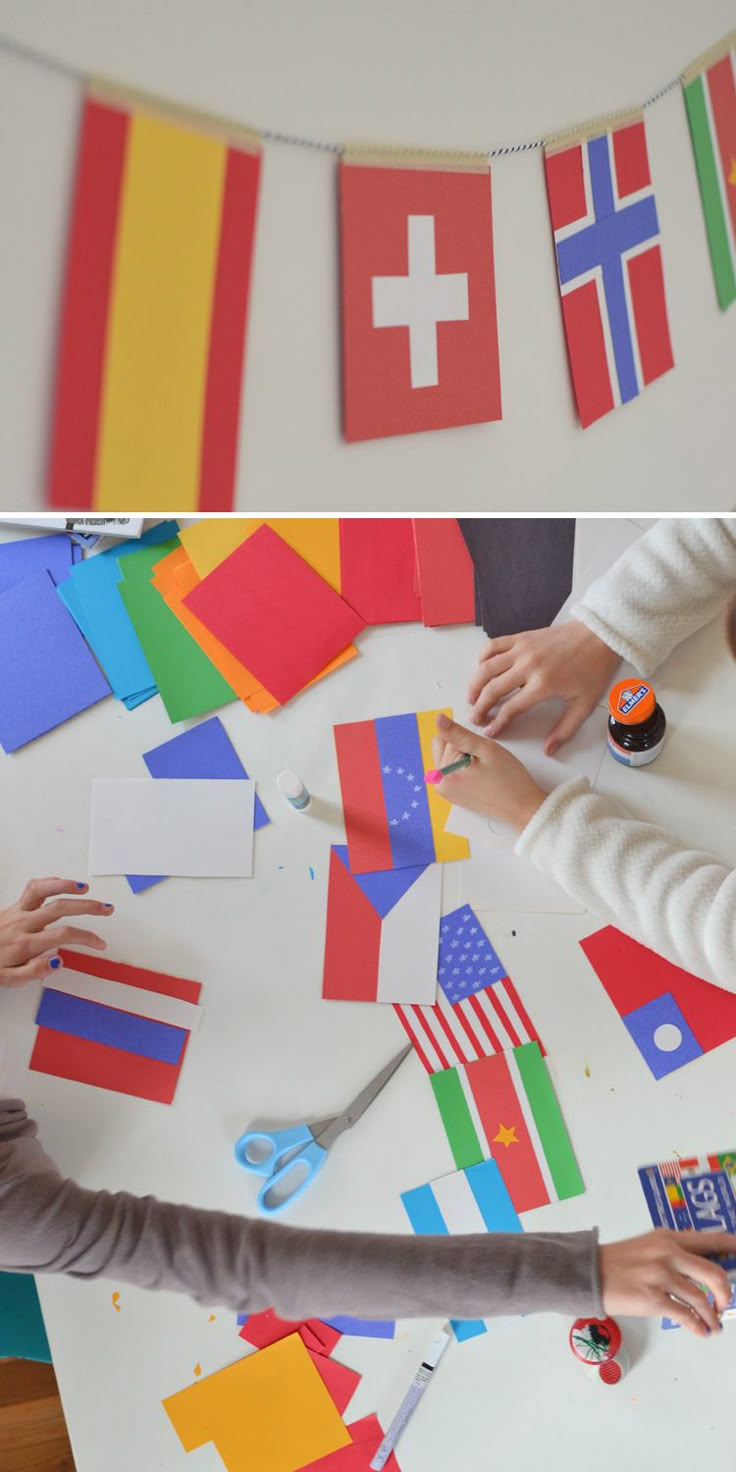 two children are making patriotic crafts with construction paper and glue on a table top together