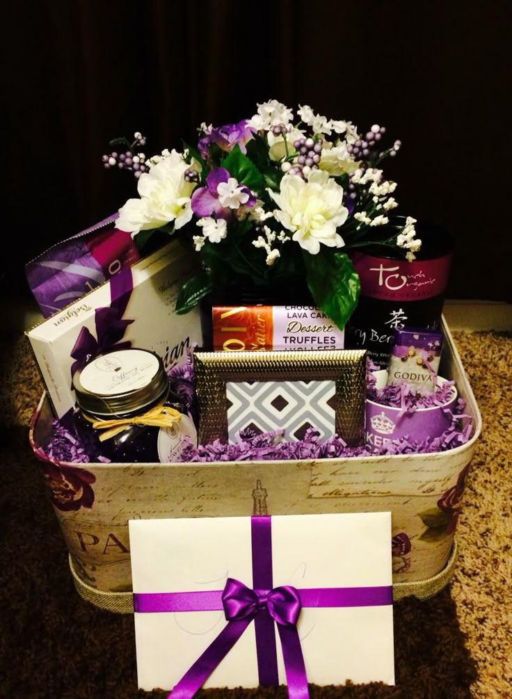 a basket filled with lots of purple and white items