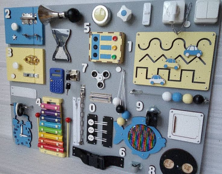 there are many different things on the wall together, including toys and magnets to make them look like they have been made out of legos