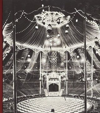 an old black and white photo of a stage with lots of lights on the ceiling