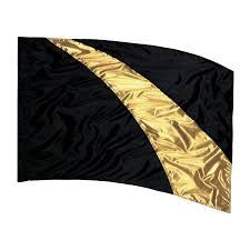 the black and gold flag is flying in the wind