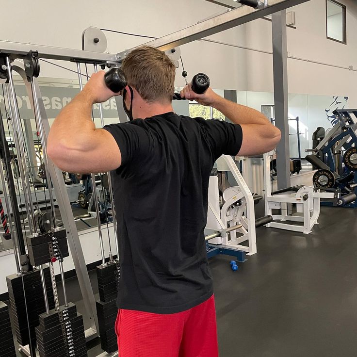 a man is doing exercises in the gym