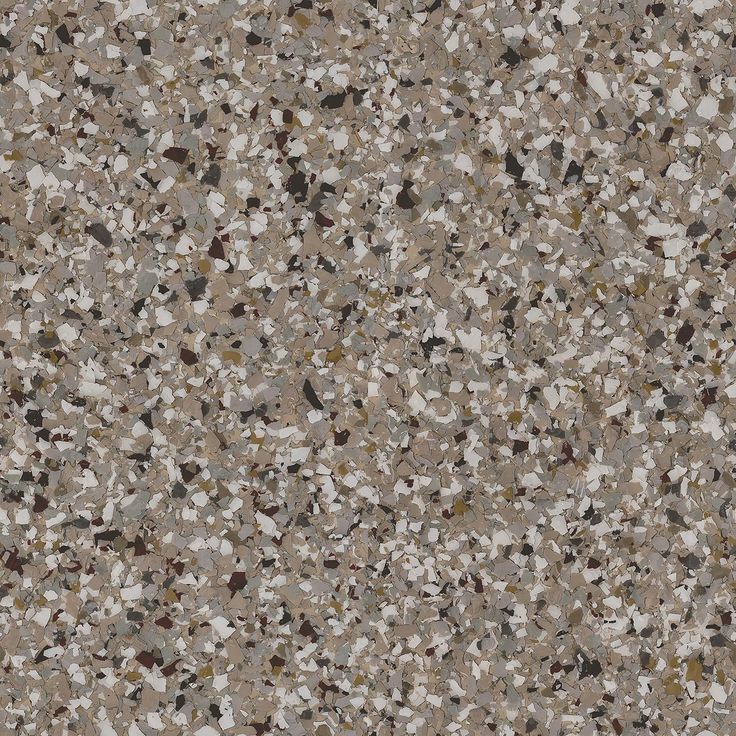 a brown and white speckled surface with small rocks on it's sides, as well as an area for text