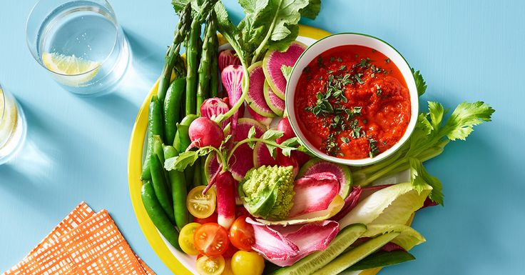 a plate full of fresh vegetables and dip