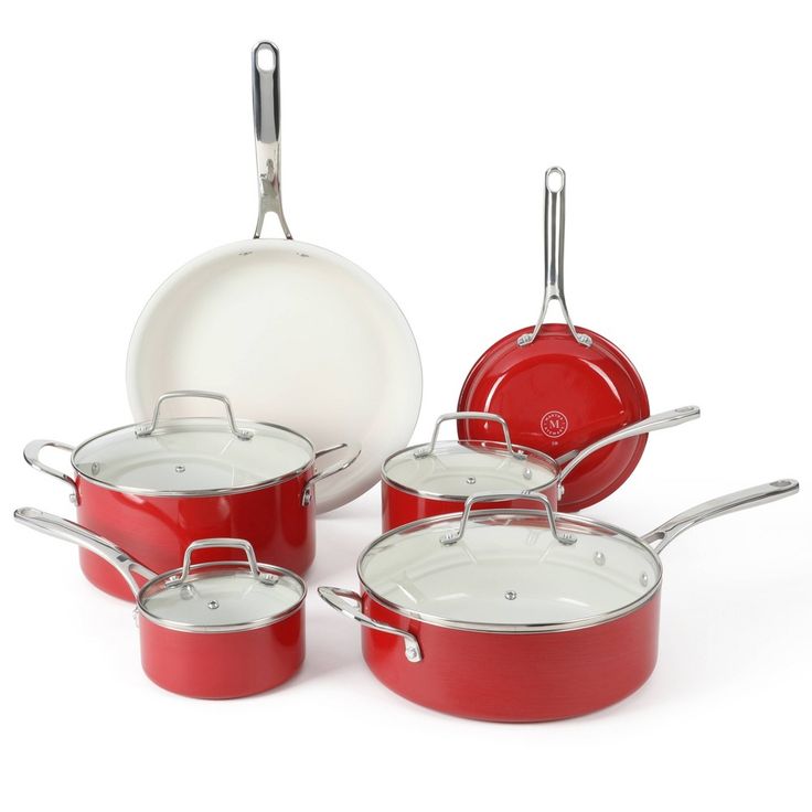 red pots and pans with white lids on a white background for use in cooking