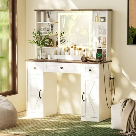 a room with a desk and shelves filled with bottles, candles and other items in it