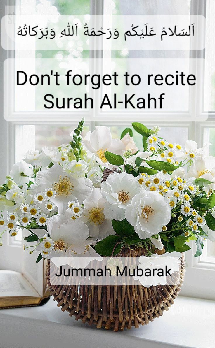 a basket filled with white flowers next to a window