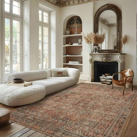 a living room with white furniture and large windows