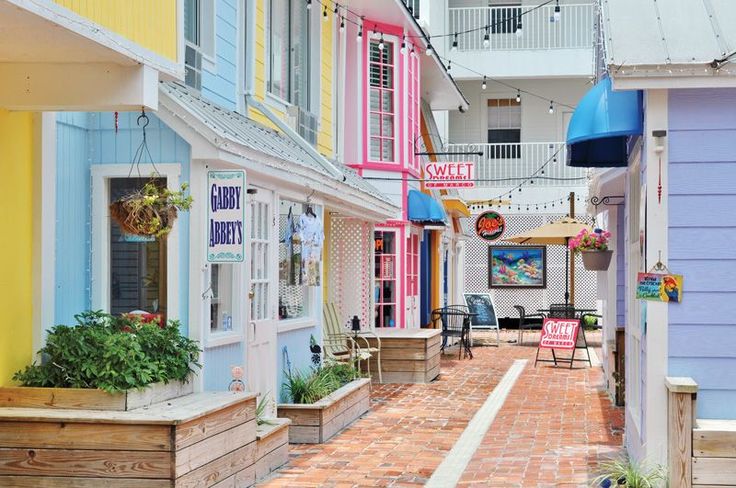 colorful buildings line the street in front of each other