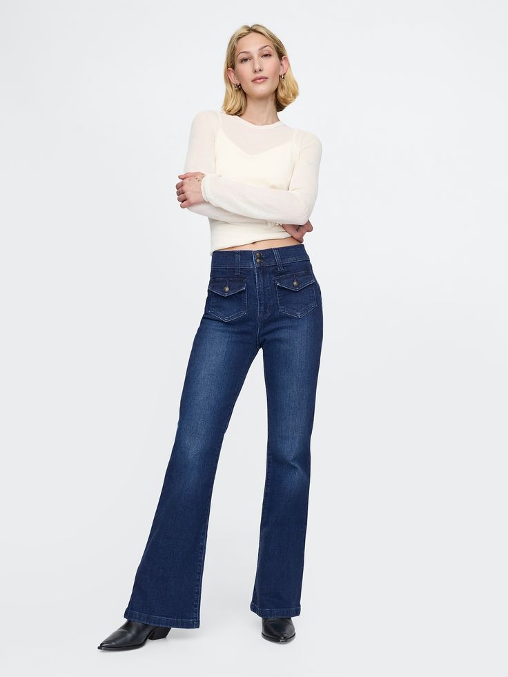 Fit: Snug & flattering through the hip & thigh with a flared leg. ​ Fabric: 86% Cotton, 13% Recycled Materials, 1% Stretch.  Stretch: High Stretch Jeans.  Innovative stretch with high recovery.  Made to move & always bounces back. ​ Rise: High Rise Jeans.  Look: A four-pocket jean in dark indigo wash.  Details: Zip fly with button-flap patch pockets at front & back.  Responsibly Made: This pair of jeans is part of our water-saving Washwell program.  Compared to conventional wash methods, Washwell has saved millions of liters of water since 2016.  Our High Rise Jean has an 11" 28 cm) rise. ​ Slim through the hip & thigh.  Flared leg.  Full-length jeans.  Hits below the ankle. ​ 21. 5" 55 cm) leg opening.  Inseam: Petite 30" 76 cm), Short 31" 78 cm), Regular 32" 81 cm), Long 34. 5" 88 cm), T Jeans Look, Retro Fits, Water Saving, Dark Indigo, Pocket Jeans, Fit Inspo, High Rise Jeans, Petite Size, Flare Pants