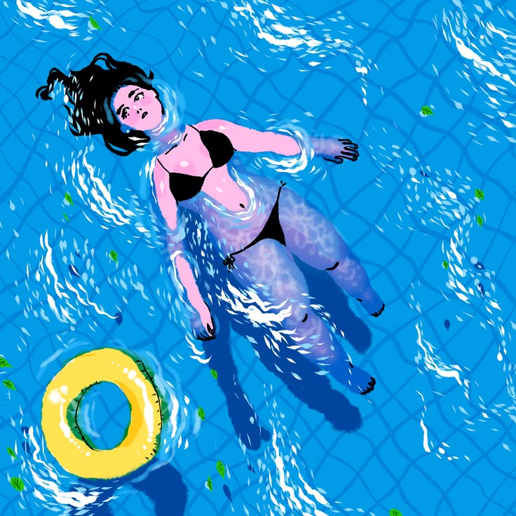 a woman floating in the water next to a life preserver