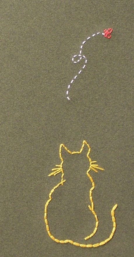 a drawing of a cat on the ground with a string attached to it's tail