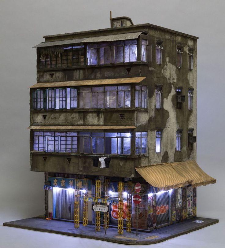 a model of a building that is lit up at night with lights on the windows