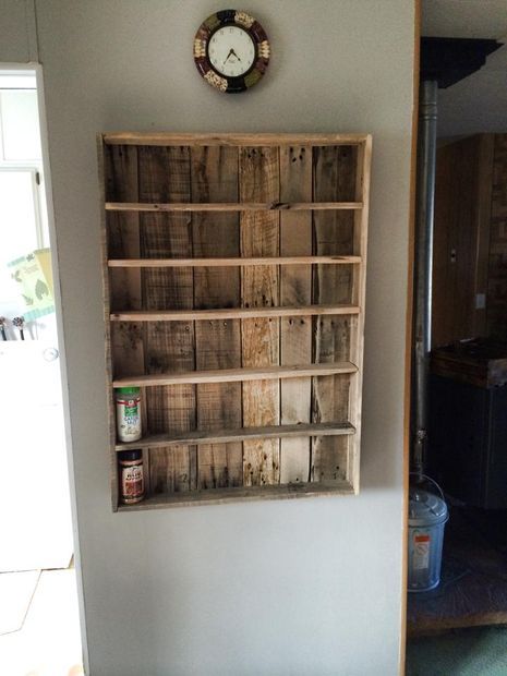 an old pallet spice rack is displayed on the wall in this instagramtion