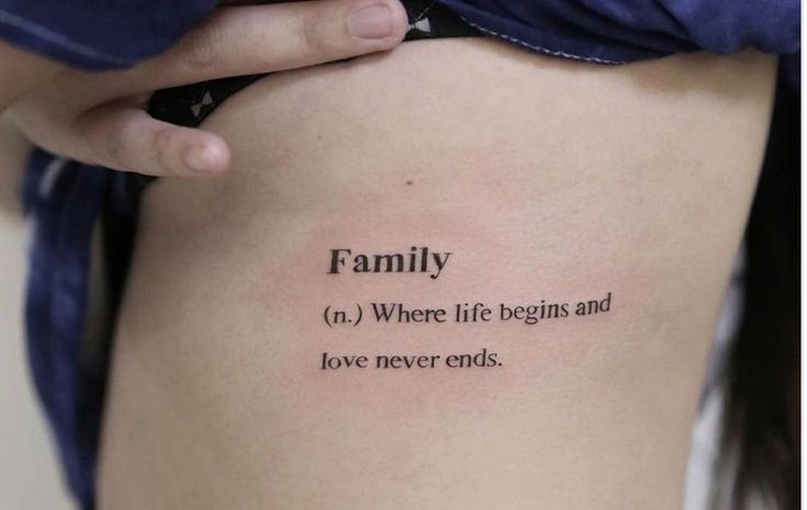 a woman's thigh with the words family on it and an image of her lower back