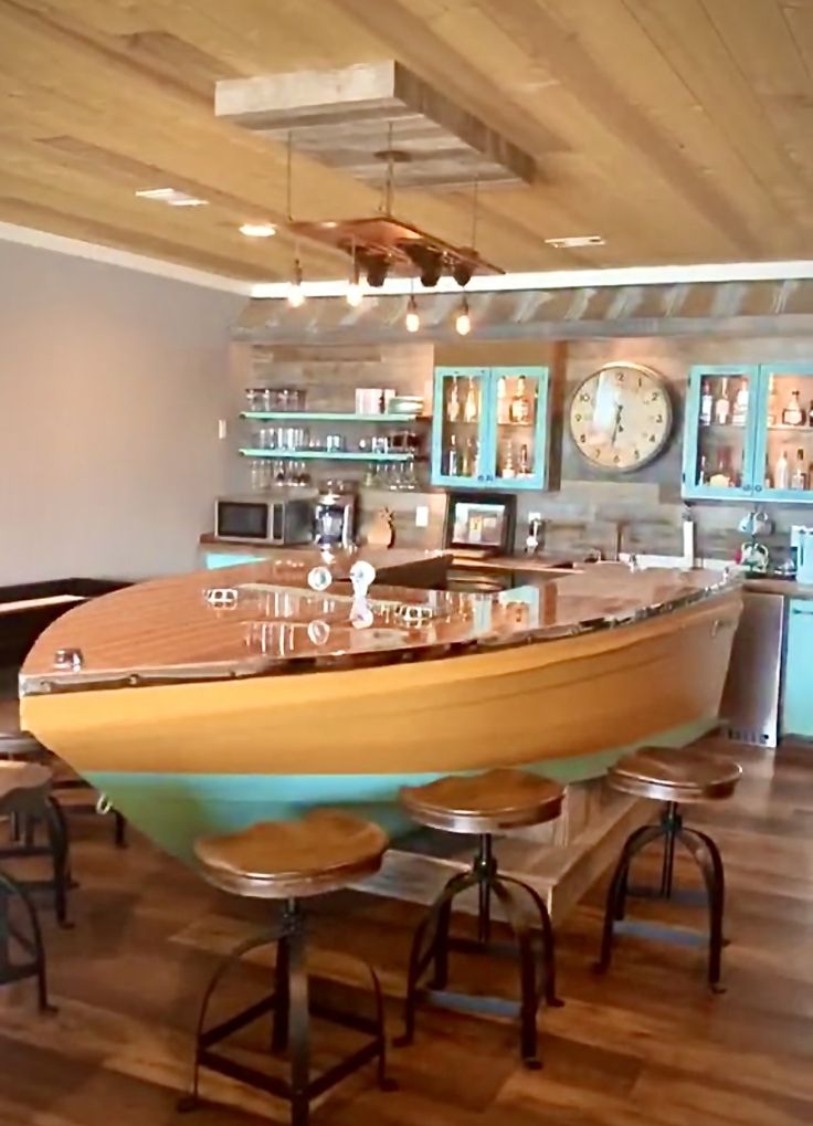 a boat shaped bar with stools in a room