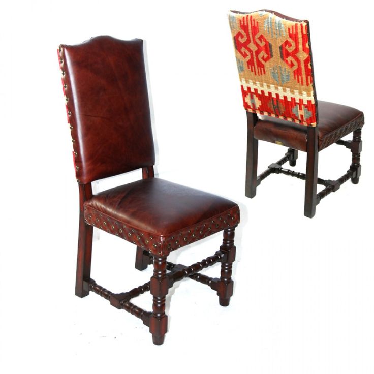 two wooden chairs with leather upholstered back and seat covers, one in red and the other in brown