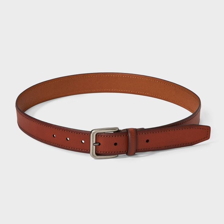 Complete your outfit in sleek style with this Leather Dress Belt from Goodfellow & Co™. This tan medium belt is made from 100% flat leather material for a comfortable and classic look. It also has a shiny silver buckle closure to complete the classy look and allows you to get a customized fit with multiple holes and loop. Pair with any of your pants to feel great all day. Goodfellow & Co™: Where style & fit are always in good company. Classic Leather Belts For Fall, Classic Leather Belt For Fall, Leather Belts For Formal Fall Occasions, Classic Fitted Belts For Fall, Formal Leather Belts For Fall, Classic Brown Belts For Fall, Classic Brown Belts For Business Casual, Classic Brown Belt For Business Casual, Brown Fitted Leather Belt